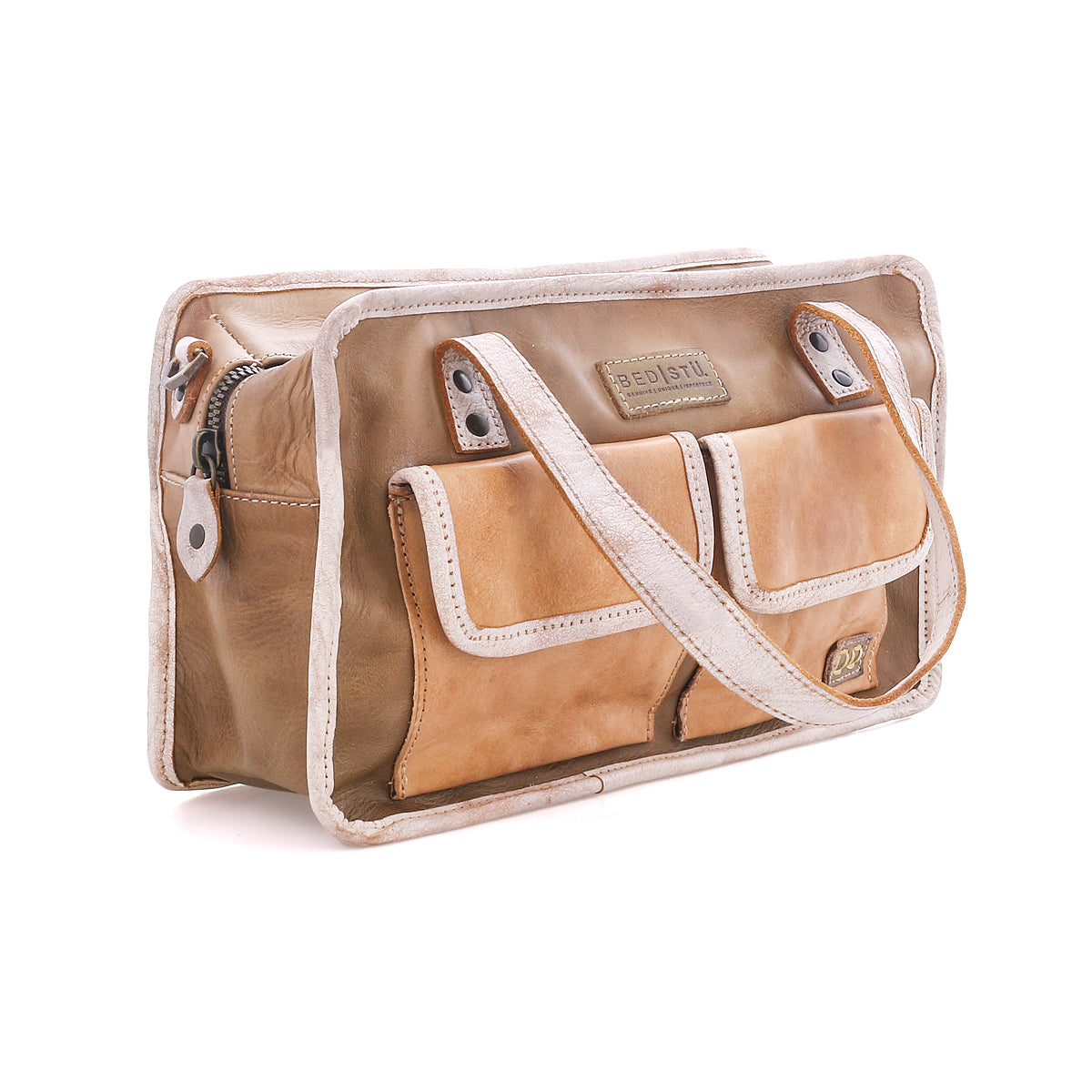 The Stuffy by Bed|Stü is a rectangular tan and beige leather shoulder bag with a structured silhouette, featuring two front pockets, a top zipper closure, and a single strap—perfect for everyday use.