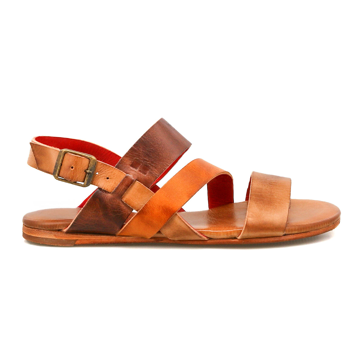 Superb by Bed|Stü is a brown leather sandal featuring an open toe, adjustable ankle strap with buckle, and a flat sole. Shown in profile view against a white background, this sandal is perfect for everyday wear.