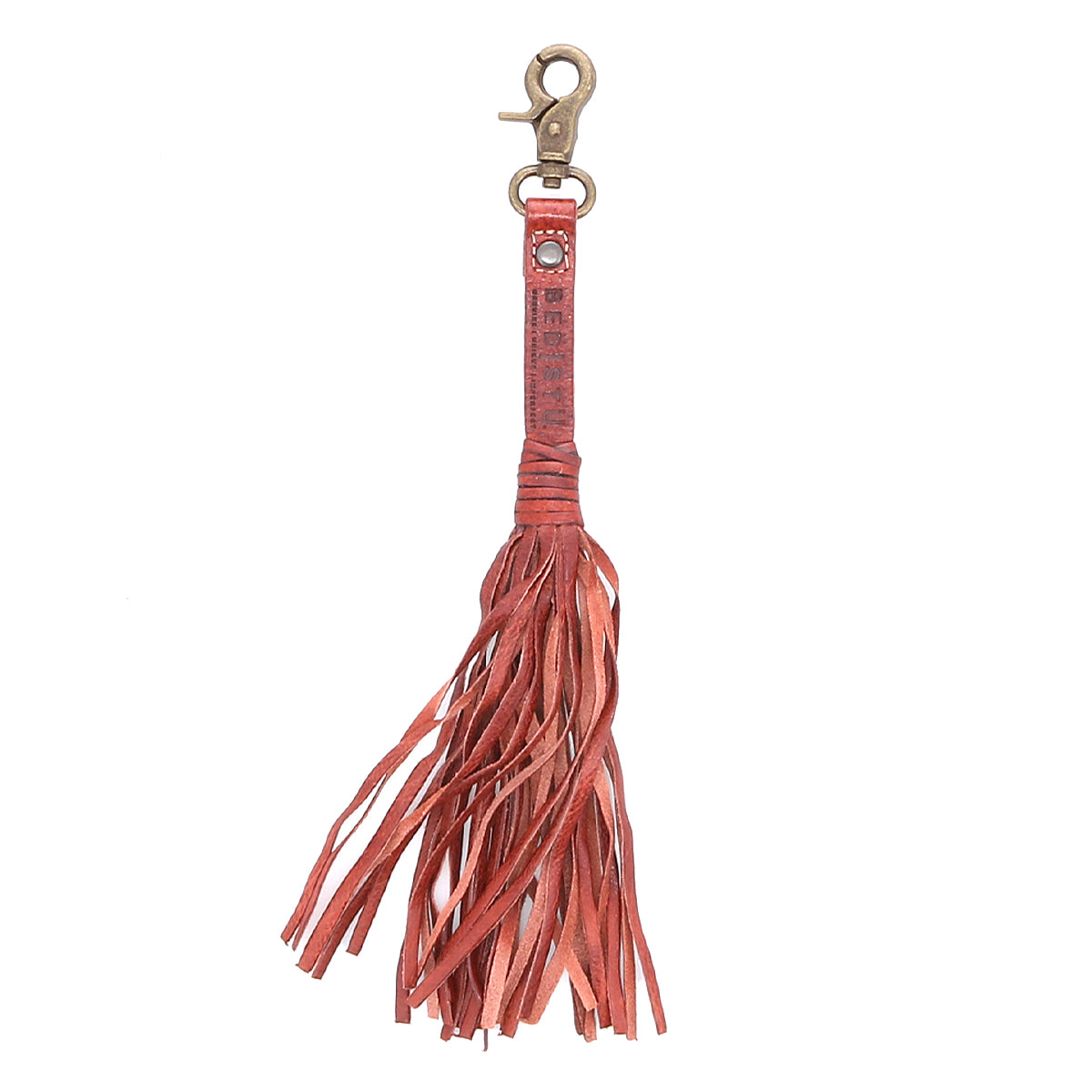 Introducing the Bed|Stü Tassel Clip—a stylish reddish-brown leather keychain featuring a sturdy metal clasp at the top and multiple leather fringes cascading down. Perfect as a bag accessory or a unique charm for your favorite tote, this Tassel Clip adds an eye-catching touch to any ensemble.