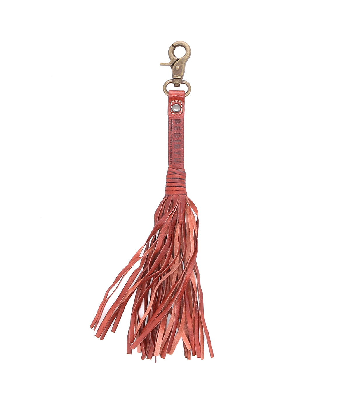 Introducing the Bed|Stü Tassel Clip—a stylish reddish-brown leather keychain featuring a sturdy metal clasp at the top and multiple leather fringes cascading down. Perfect as a bag accessory or a unique charm for your favorite tote, this Tassel Clip adds an eye-catching touch to any ensemble.