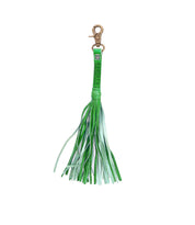 Add a touch of flair to your favorite tote with the Bed|Stü Tassel Clip—a chic green leather tassel keychain featuring multiple thin fringe strands and a gold-tone lobster clasp. This stylish bag accessory doubles as a keychain charm or leather tassel clip.