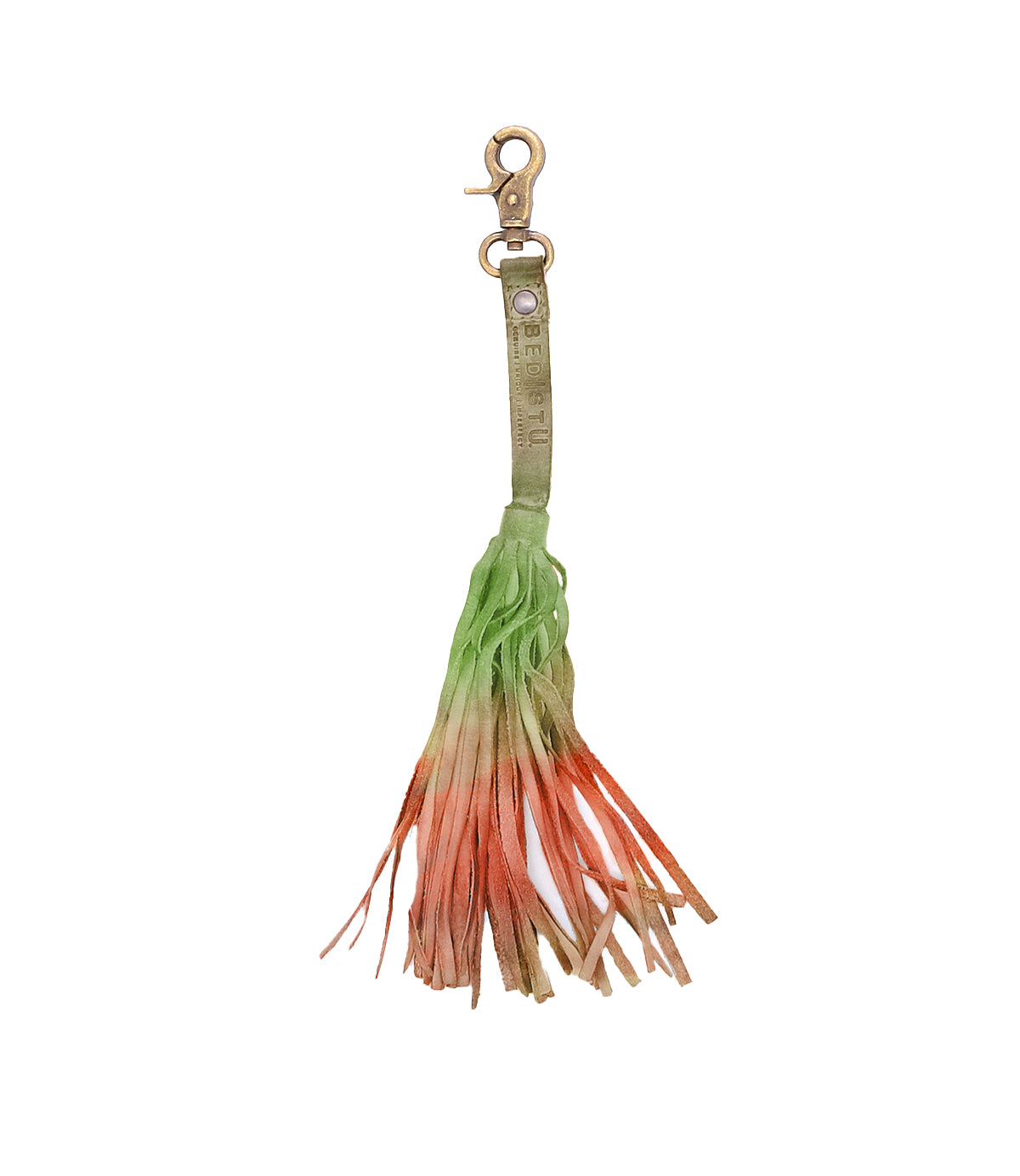 The Bed|Stü Tassel Clip features a leather keychain charm with a brass clasp and a fringed tassel in green, orange, and tan—perfect as a stylish bag accessory or leather tassel clip.