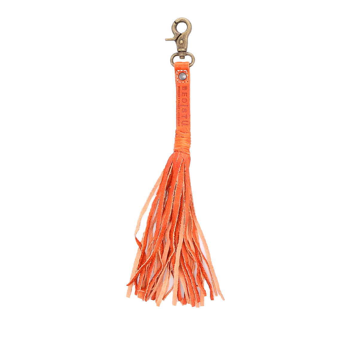 Bed|Stü Tassel Clip: An orange leather keychain charm featuring a metal clasp and multiple fringe strands, perfect as a stylish bag accessory or for attaching to your keys.