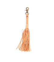 Tan leather Tassel Clip by Bed|Stü, featuring fringed strands, a metal clasp, and "Bed|Stü" embossed on the strap—a chic keychain charm that elevates your everyday look.