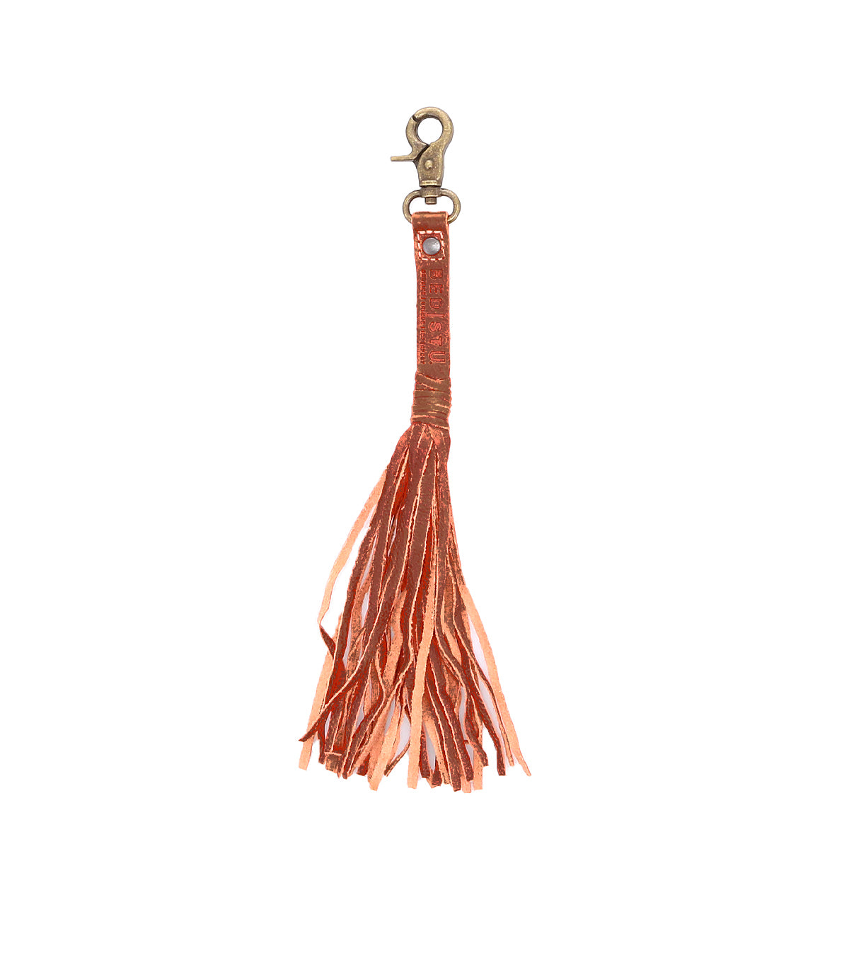 The Bed|Stü Tassel Clip is a rust-colored leather keychain featuring multiple fringed strands hanging from a looped strap and finished with a brass clasp—perfect for adding a stylish accent to your keys or bag.