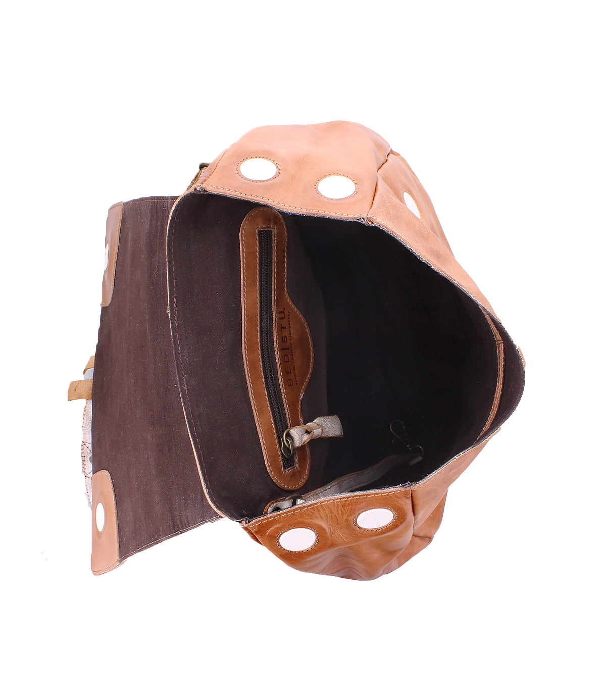 Introducing the Teji by Bed|Stü—an open tan leather handbag featuring a rich brown interior, zippered pocket, and eye-catching large grommet accents on the flap and sides. This slouchy shoulder bag blends effortless style with everyday functionality.