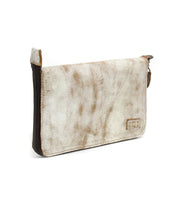 The Templeton II by Bed|Stü is a rectangular clutch crafted from distressed beige leather, featuring a zipper closure and a small stitched label on one side, shown against a white background.