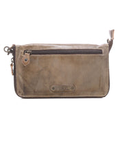 Introducing the Templeton II by Bed|Stü—a rectangular brown leather pouch featuring a front zipper pocket, small leather tab, and side loop. Use it as a chic clutch, an everyday wallet, or slip it neatly into your favorite leather crossbody.