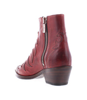 Rear view of the Tentativa handcrafted Italian boot by Bed|Stü in red leather, featuring decorative stitching, a side zipper, and a vintage Western-inspired stacked low heel, photographed on a white background.