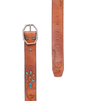 The Upswing II by Bed|Stü is a brown handcrafted leather belt featuring decorative stitching, turquoise accents, and a silver hexagonal buckle, displayed from both the buckle and tip ends. This artisanal piece showcases subtle floral design details, giving a unique touch to its classic style.