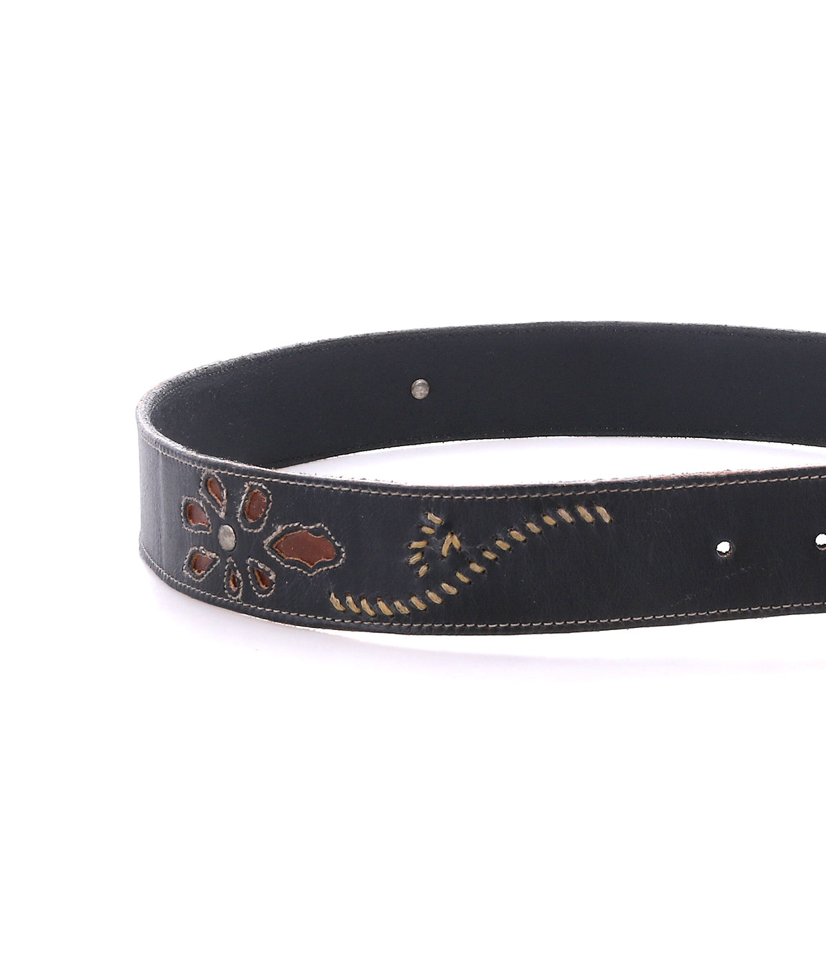 The Upswing II by Bed|Stü is a handcrafted black leather belt featuring a floral cutout design, brown accents, and decorative yellow stitching—perfect for adding an artisanal touch to any outfit.