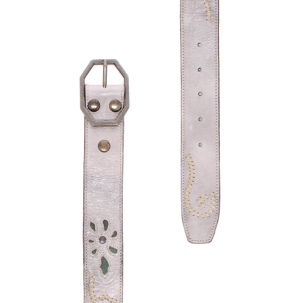 Introducing the Bed|Stü Upswing II: a light gray handcrafted leather belt featuring a metal buckle, decorative stitching, and a distinctive cut-out floral pattern. This artisanal belt showcases elegant detailing that seamlessly blends style with expert craftsmanship. Shown in both front and side views against a white background.