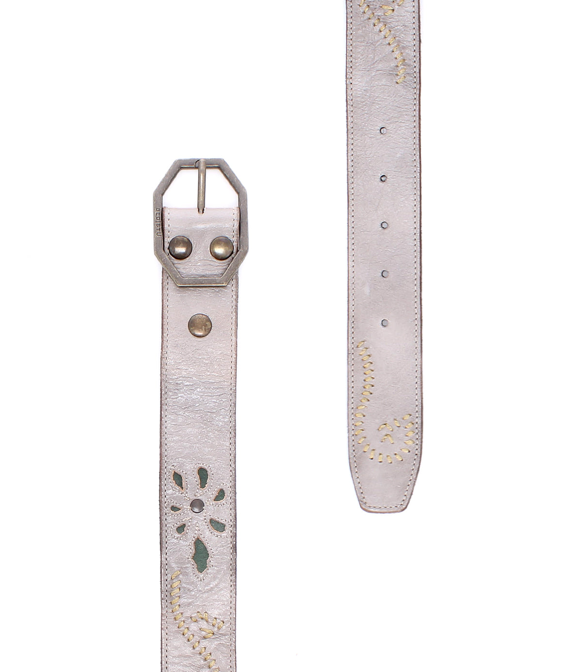 Introducing the Bed|Stü Upswing II: a light gray handcrafted leather belt featuring a metal buckle, decorative stitching, and a distinctive cut-out floral pattern. This artisanal belt showcases elegant detailing that seamlessly blends style with expert craftsmanship. Shown in both front and side views against a white background.