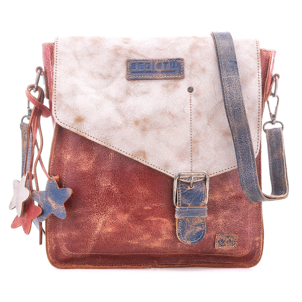 Introducing the Venice Beach crossbody by Bed|Stü—a vintage-inspired bag made from full-grain leather, showcasing a flap closure, buckle detail, star-shaped keychains, and an adjustable strap in distressed red, white, and blue hues.