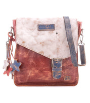 Introducing the Venice Beach crossbody by Bed|Stü—a vintage-inspired bag made from full-grain leather, showcasing a flap closure, buckle detail, star-shaped keychains, and an adjustable strap in distressed red, white, and blue hues.