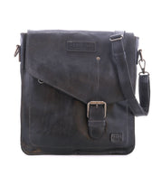 The Bed|Stü Venice Beach messenger bag is crafted from black full-grain leather and features a front buckle, an embossed "BED|STÜ" logo, and an adjustable shoulder strap. Shown against a plain white background, this versatile crossbody bag merges timeless style with practical design.