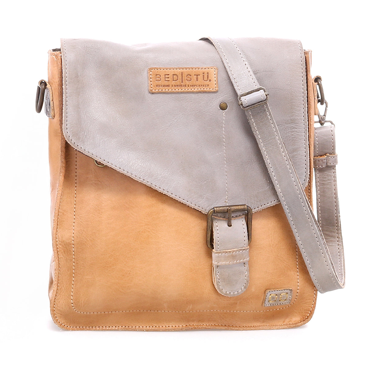 Discover the Venice Beach crossbody bag by Bed|Stü, expertly crafted from luxurious full-grain leather with a stylish tan body and gray flap. It features an adjustable strap for personalized comfort, a secure buckle closure, and a visible Bed|Stü brand patch on the flap.