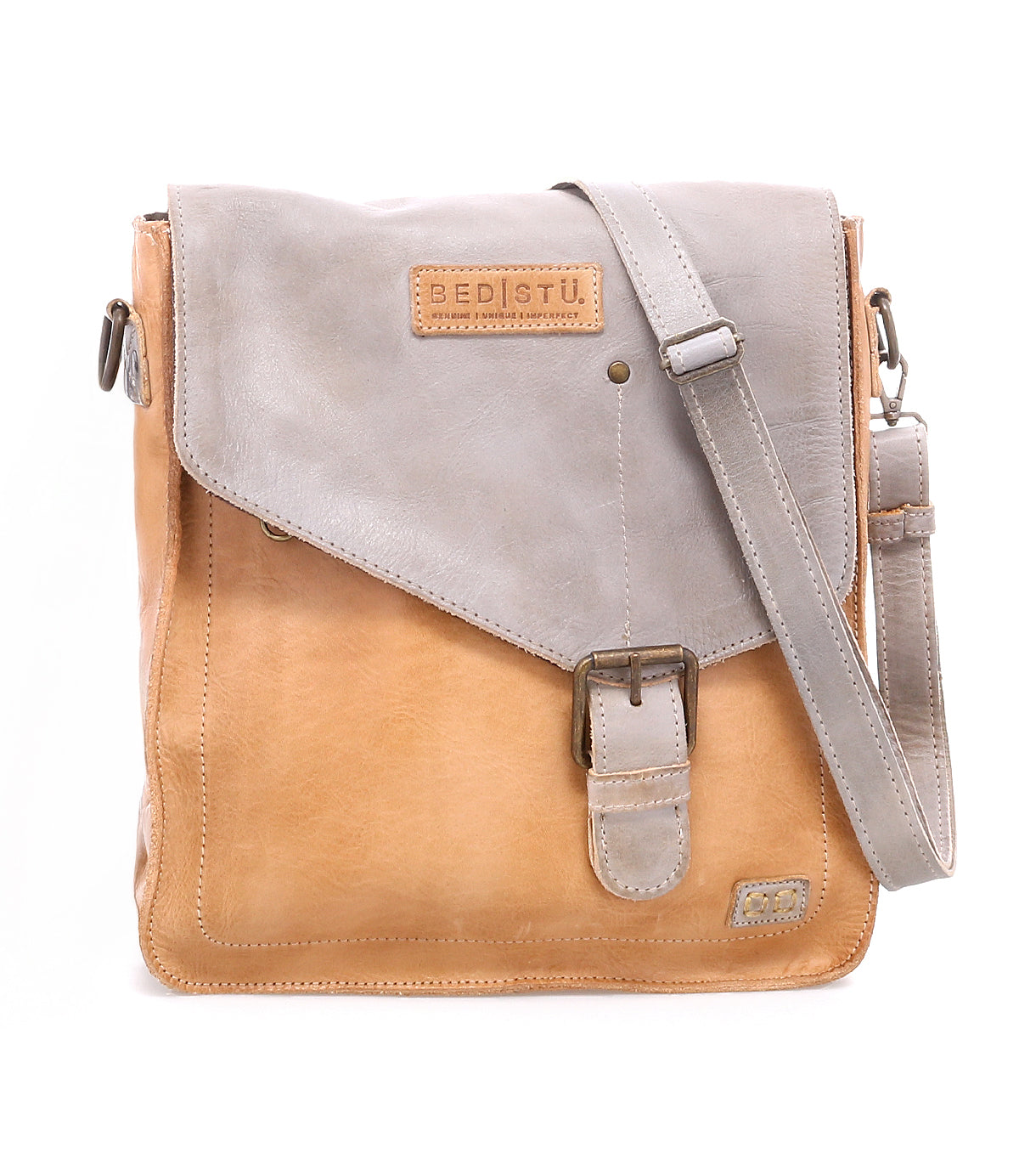 Discover the Venice Beach crossbody bag by Bed|Stü, expertly crafted from luxurious full-grain leather with a stylish tan body and gray flap. It features an adjustable strap for personalized comfort, a secure buckle closure, and a visible Bed|Stü brand patch on the flap.