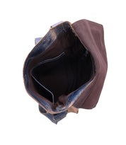 Top view of an open, empty Bed|Stü Venice Beach crossbody bag, crafted from full-grain leather with a brown interior and visible inner pocket, featuring an adjustable strap, displayed against a white background.