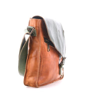 Side view of the Bed|Stü Venice Beach messenger bag in brown full-grain leather with a green flap and adjustable strap, photographed on a white background.