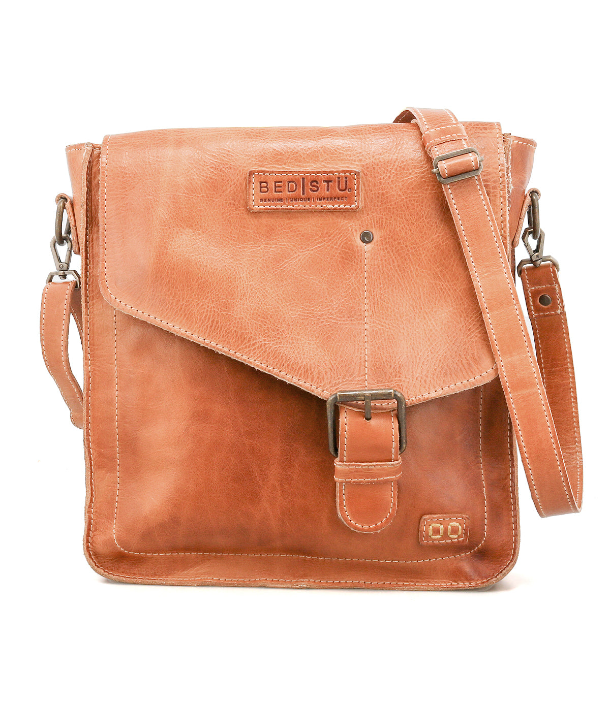 The Venice Beach crossbody bag by Bed|Stü features light brown full-grain leather, a flap closure with buckle detail, an adjustable strap, and the embossed Bed|Stü logo on the front.