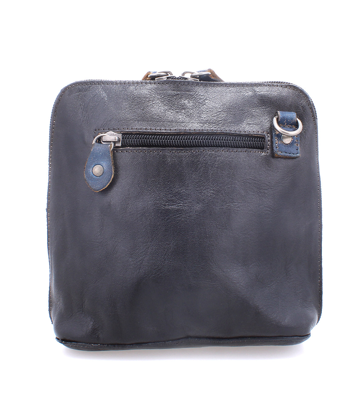 The Bed|Stü Ventura is a square-shaped black leather crossbody bag with a lightweight design, featuring an exterior zip pocket, silver zipper pull, and a small metal ring near the top right corner, shown against a white background.