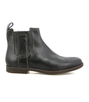 The Verrocchio by Bed|Stü is a black handcrafted leather Chelsea boot featuring an elastic side panel, back pull tab, and brown sole. Displayed in a left side profile view on a white background, this versatile boot is perfect for everyday wear.