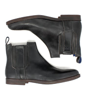 A pair of Verrocchio black handcrafted leather Chelsea boots by Bed|Stü, featuring elastic side panels and low heels, shown from the side and bottom against a white background—ideal for everyday wear.