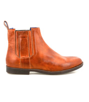 The Bed|Stü Verrocchio is a handcrafted leather Chelsea boot featuring side elastic panels, a pull tab, and a low heel for everyday wear, displayed in a left side profile against a white background.
