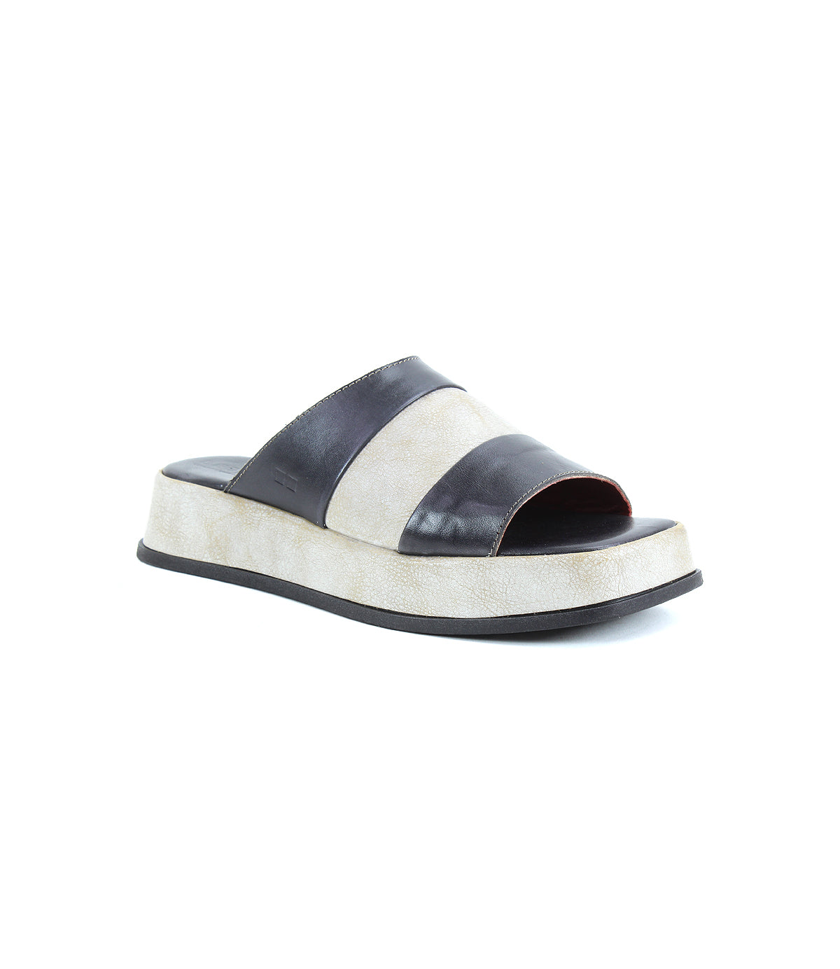 The Bed|Stü Vext is a black and white platform slide sandal featuring a wide strap over the top, an open toe, and a thick leather-wrapped sole, displayed against a plain white background.