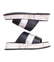 A pair of Bed|Stü Vext platform slide sandals featuring thick, black and white striped leather-wrapped soles are displayed side by side on a white background.