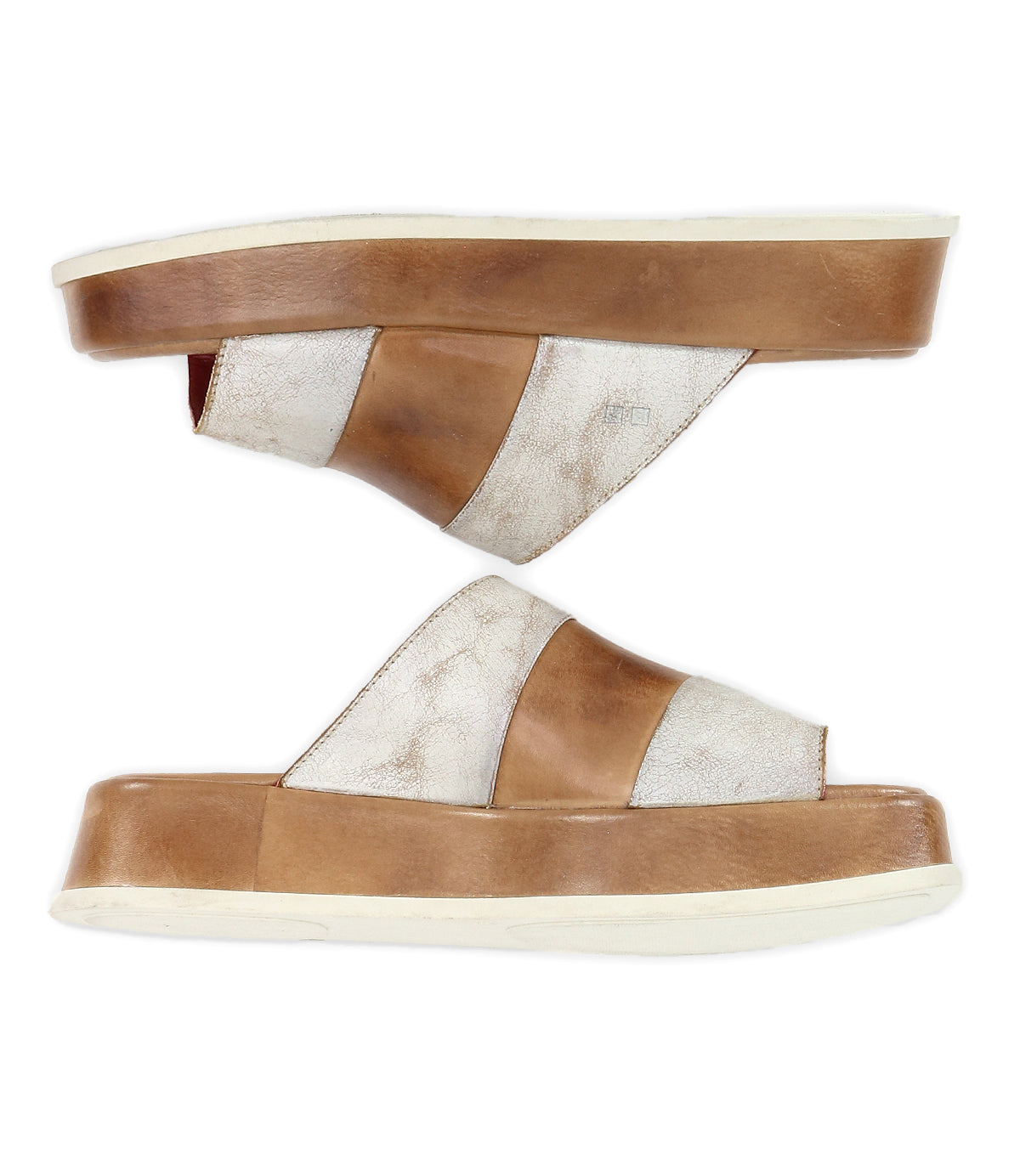 A pair of Bed|Stü Vext slip-on square-toe sandals featuring thick brown and off-white crisscross straps and flat, white outsoles, displayed side by side against a white background.