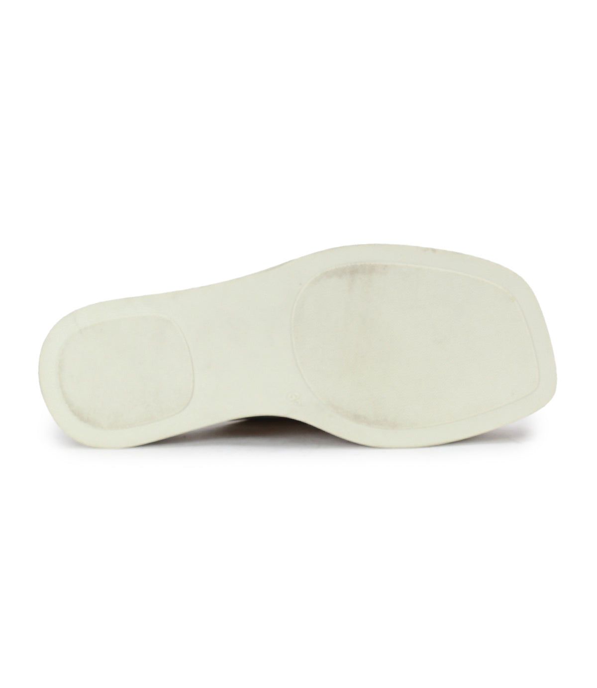 The image displays the bottom view of the Vext by Bed|Stü, featuring a white leather-wrapped sole with minimal tread and a rectangular toe shape, hallmark attributes of this modern platform slide sandal.