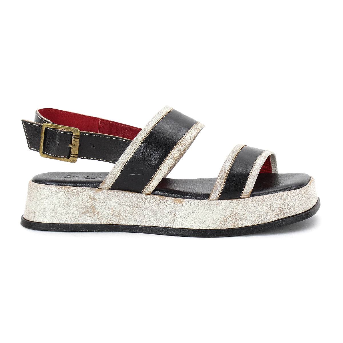 The Vice sandal by Bed|Stü is shown in a side profile view, featuring a black platform design with two straps, a gold buckle, and a thick, textured white sole. Its adjustable ankle strap offers added comfort and support.