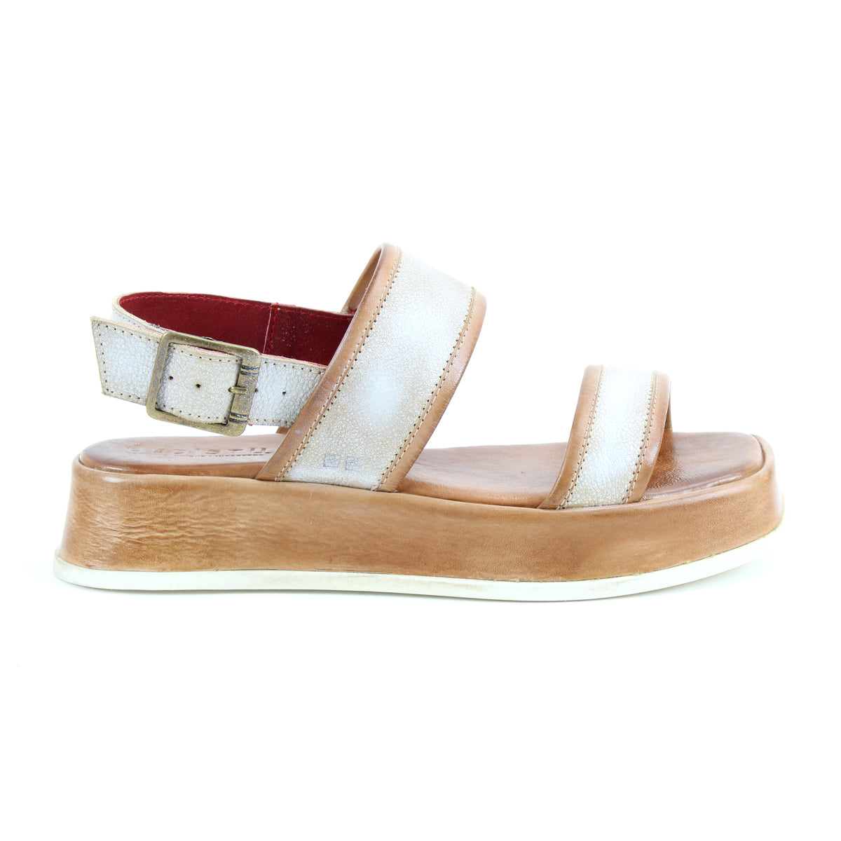 The Bed|Stü Vice sandal, displayed on a white background, features a white and tan platform design with a thick sole, adjustable ankle strap with buckle, and open toes.
