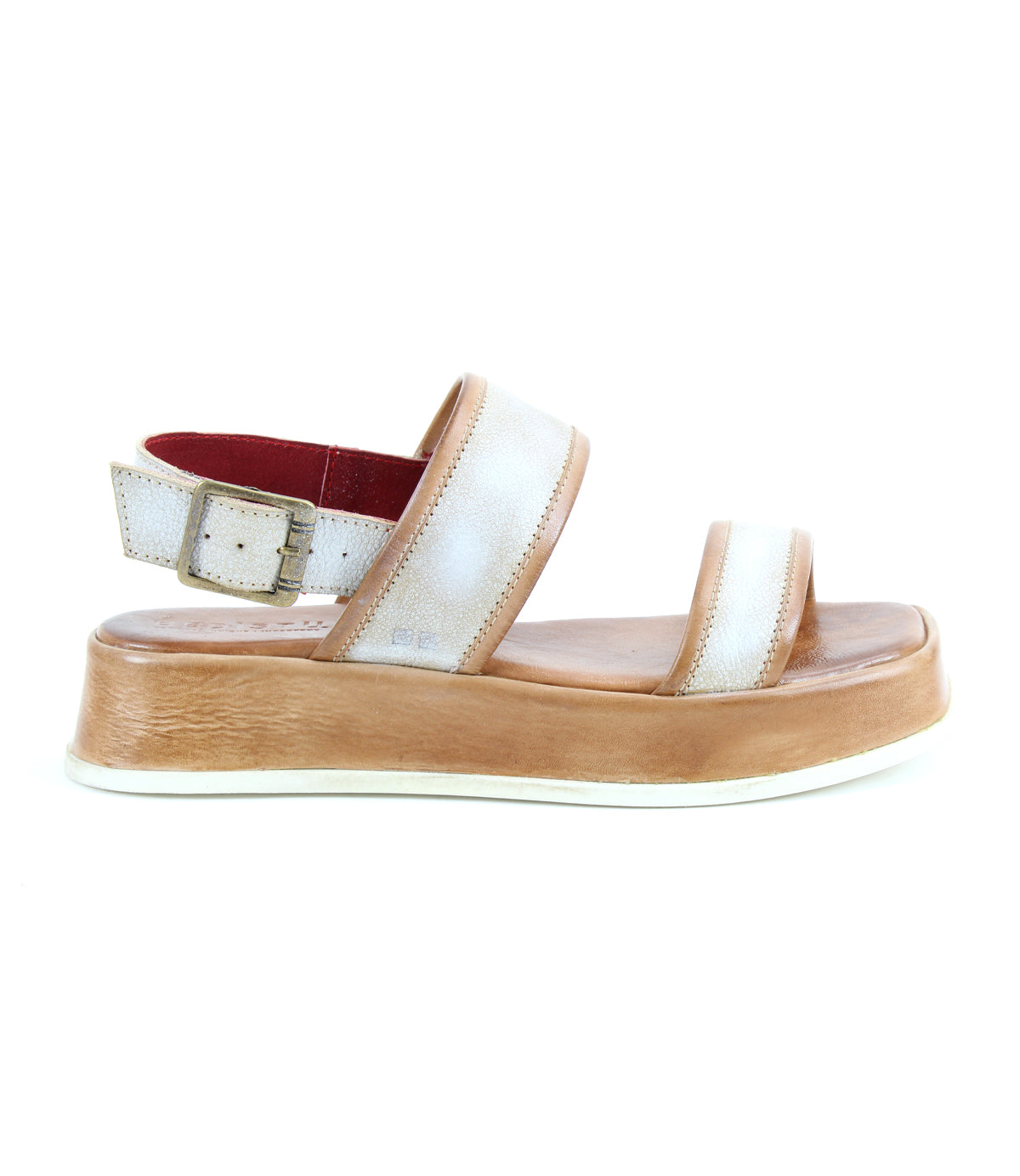 The Bed|Stü Vice sandal, displayed on a white background, features a white and tan platform design with a thick sole, adjustable ankle strap with buckle, and open toes.