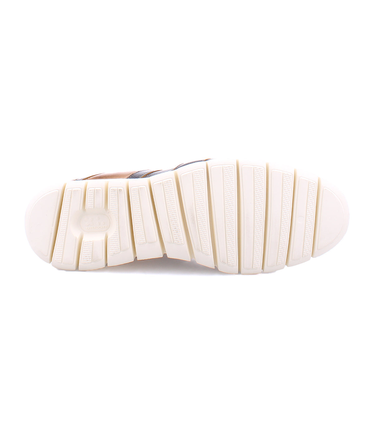 The image shows the bottom view of the Bed|Stü Wardell sneaker, featuring a white rubber sole with textured, rectangular treads and grooves that highlight the cushioned design for added comfort in this modern, layered leather shoe.