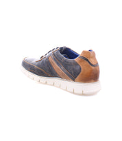 Wardell by Bed|Stü is a casual men's sneaker crafted in layered black and brown leather, showcasing a modern edge with a white rubber cushioned sole. The shoe is pictured from the back left side, isolated on a white background.