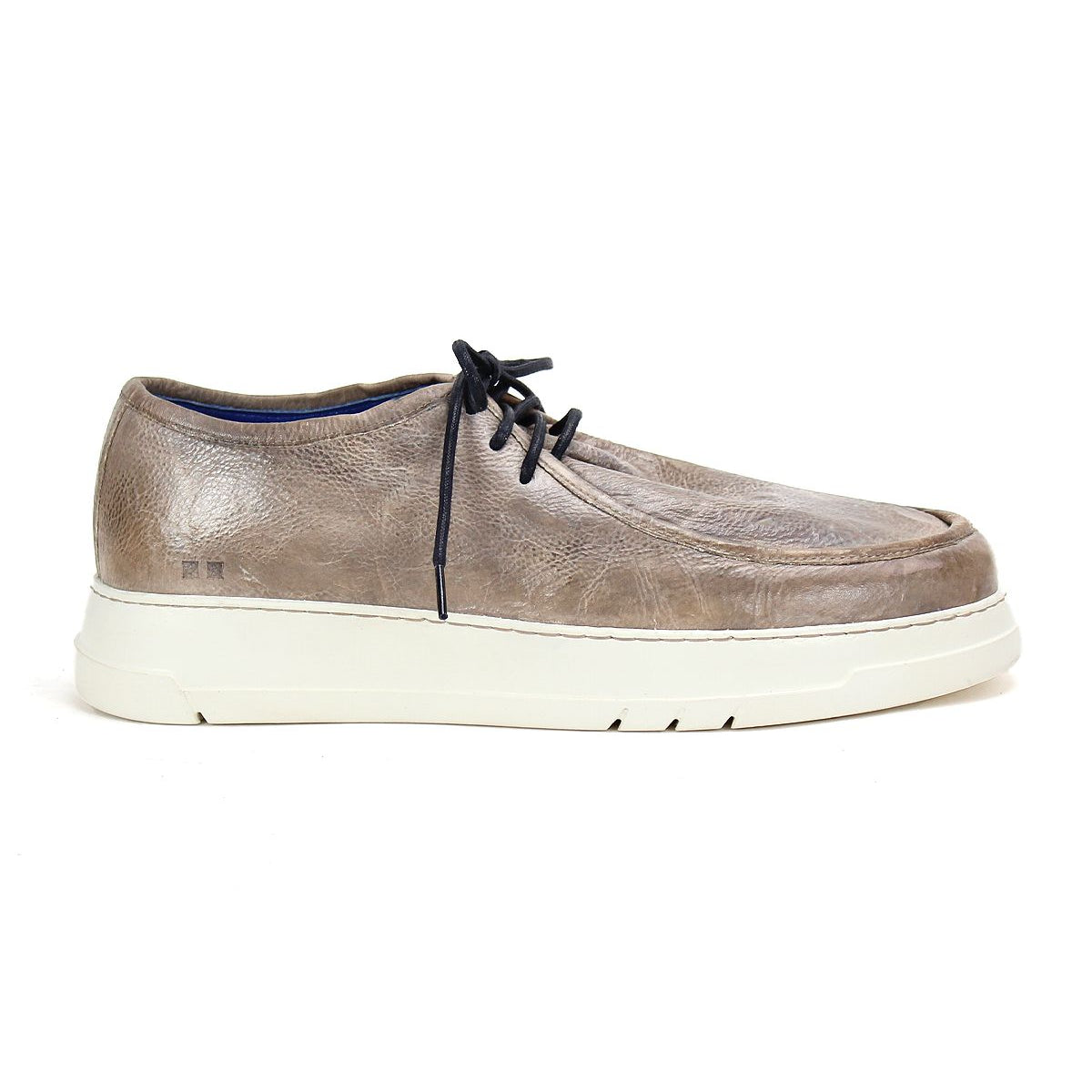 The Webmaster sneaker by Bed|Stü is displayed in side profile on a plain white background, featuring a taupe leather moc-toe design with black laces and a white rubber sole.