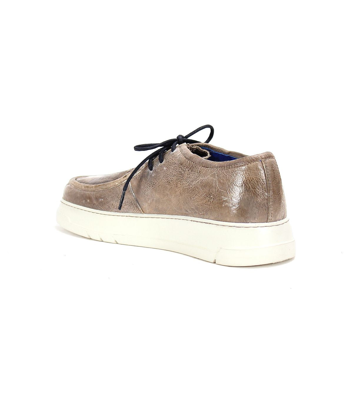 Bed|Stü’s Webmaster is a brown leather casual moc-toe sneaker featuring a black lace-up design and a white rubber sole, displayed angled from the back left side against a white background.