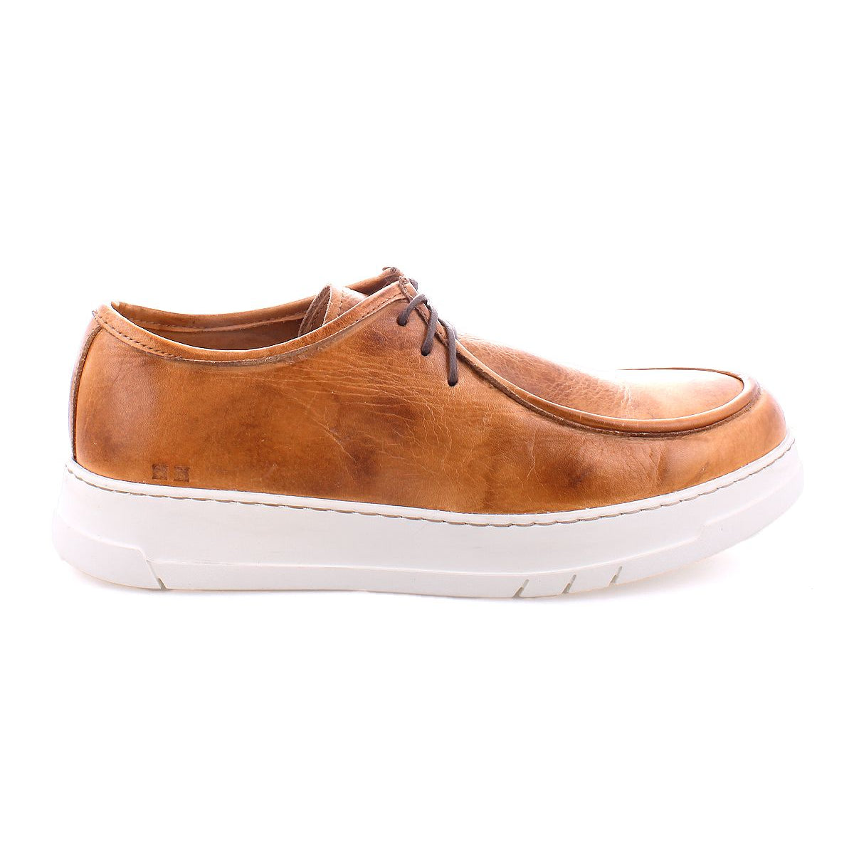 Introducing the Bed|Stü Webmaster: a brown leather moc-toe sneaker with dark brown laces and a white rubber sole, showcasing a lace-up design. Shown from the side against a white background.