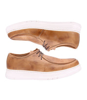 Bed|Stü’s Webmaster sneakers, a pair of tan leather lace-up casual shoes featuring a moc-toe design and white rubber soles, are displayed side by side against a white background.