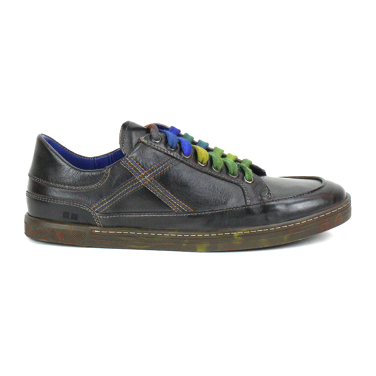 Introducing the Wizard sneaker by Bed|Stü: a black, low-profile leather shoe featuring multicolored laces, distinctive crossover stitching, and a brown rubber sole—all crafted from premium leather and showcased in side profile against a white background.