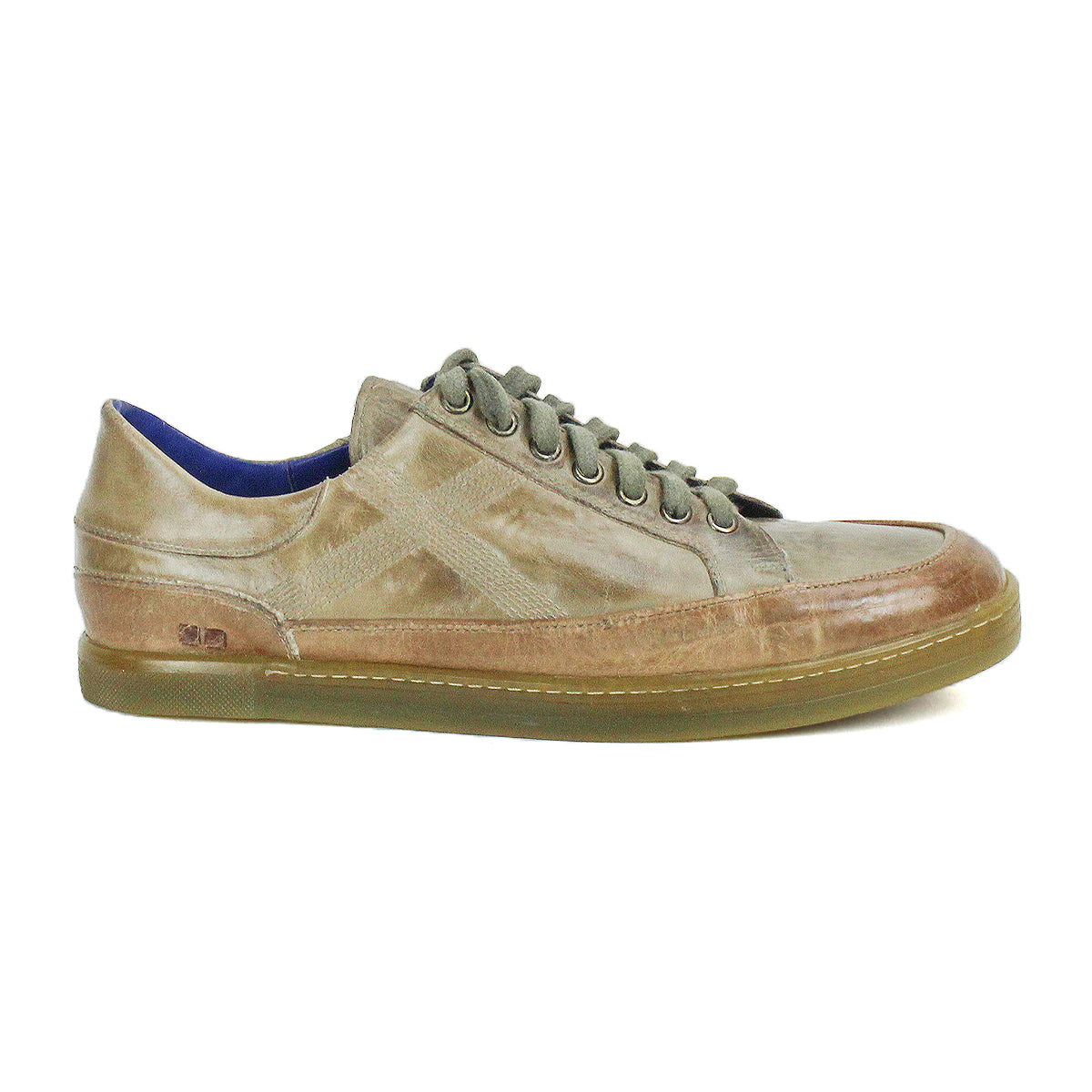 The Bed|Stü Wizard is a low-profile brown leather sneaker featuring crossover stitching, laces, a rubber sole, and a side logo. Shown in left side profile against a white background.