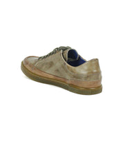 A single Bed|Stü Wizard low-profile leather sneaker with laces, crafted from brown all-leather and featuring subtle crossover stitching, is viewed from the rear left side against a white background.
