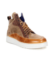 The Bed|Stü Workbench is a brown and tan men’s high-top sneaker featuring a cushioned rubber sole, tan laces, and a blue inner tongue, designed for everyday versatility and shown at a slight angle.