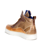 Bed|Stü Workbench men’s high-top sneaker with a cushioned rubber sole, white exterior, blue inner lining, and tan leather accents—viewed from the back left side and crafted for everyday versatility.