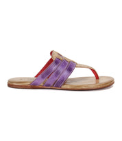 The Yoli sandal by Bed|Stü features a tan sole, a red toe strap, and purple and tan crisscross woven upper straps, displayed in a side profile view.