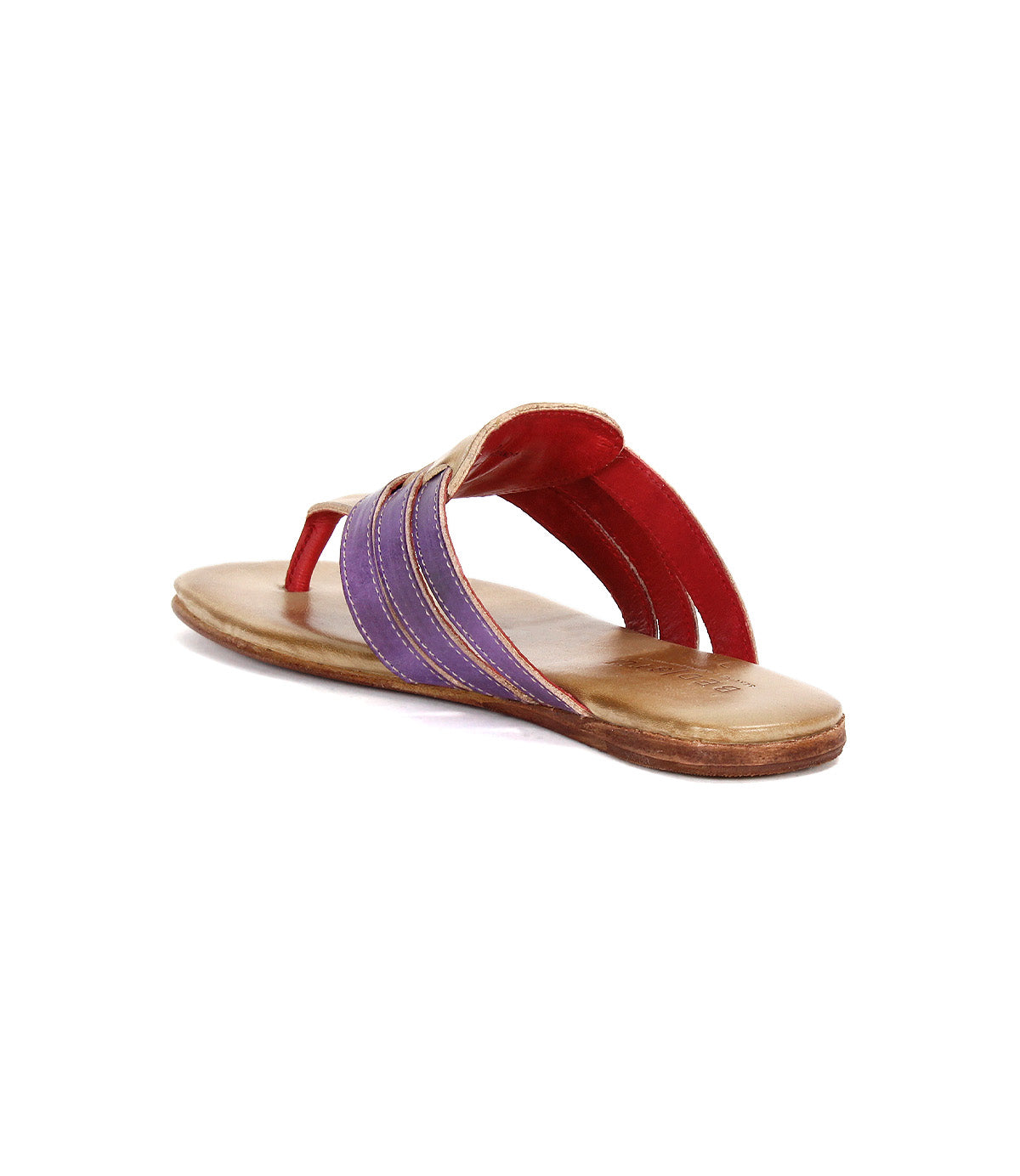 The Bed|Stü Yoli sandal is shown from a rear angled view, featuring a tan sole, purple and red leather straps with visible stitching, and a cushioned insole.