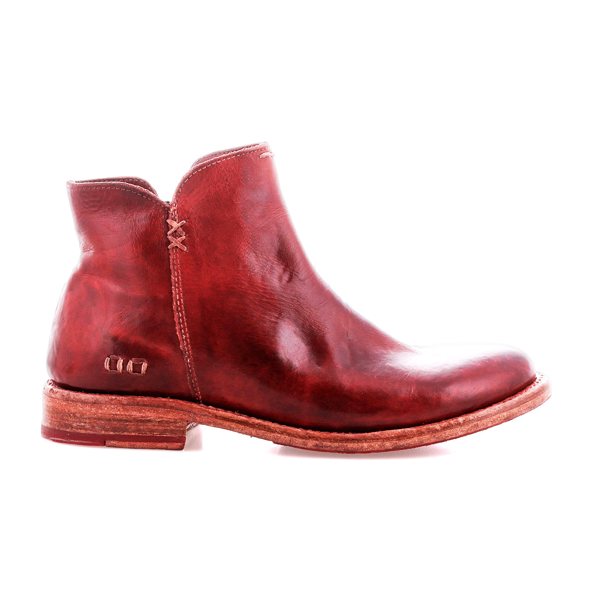 A single Yurisa ankle boot by Bed|Stü in red leather, featuring a low heel, visible stitching, and a durable leather outsole, is shown in a left side profile against a white background.